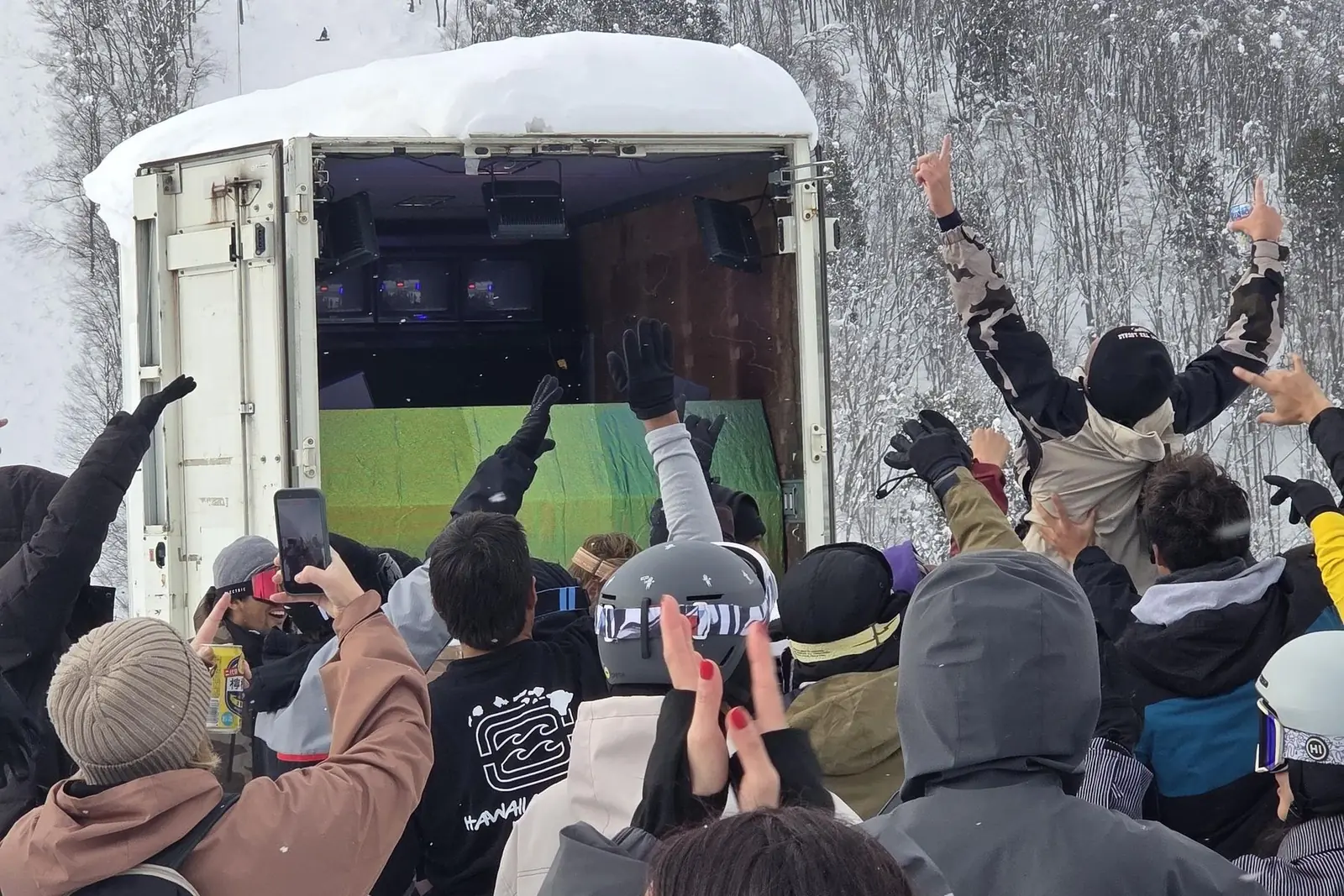 The crowd with hands up in front of the Party Peak stage