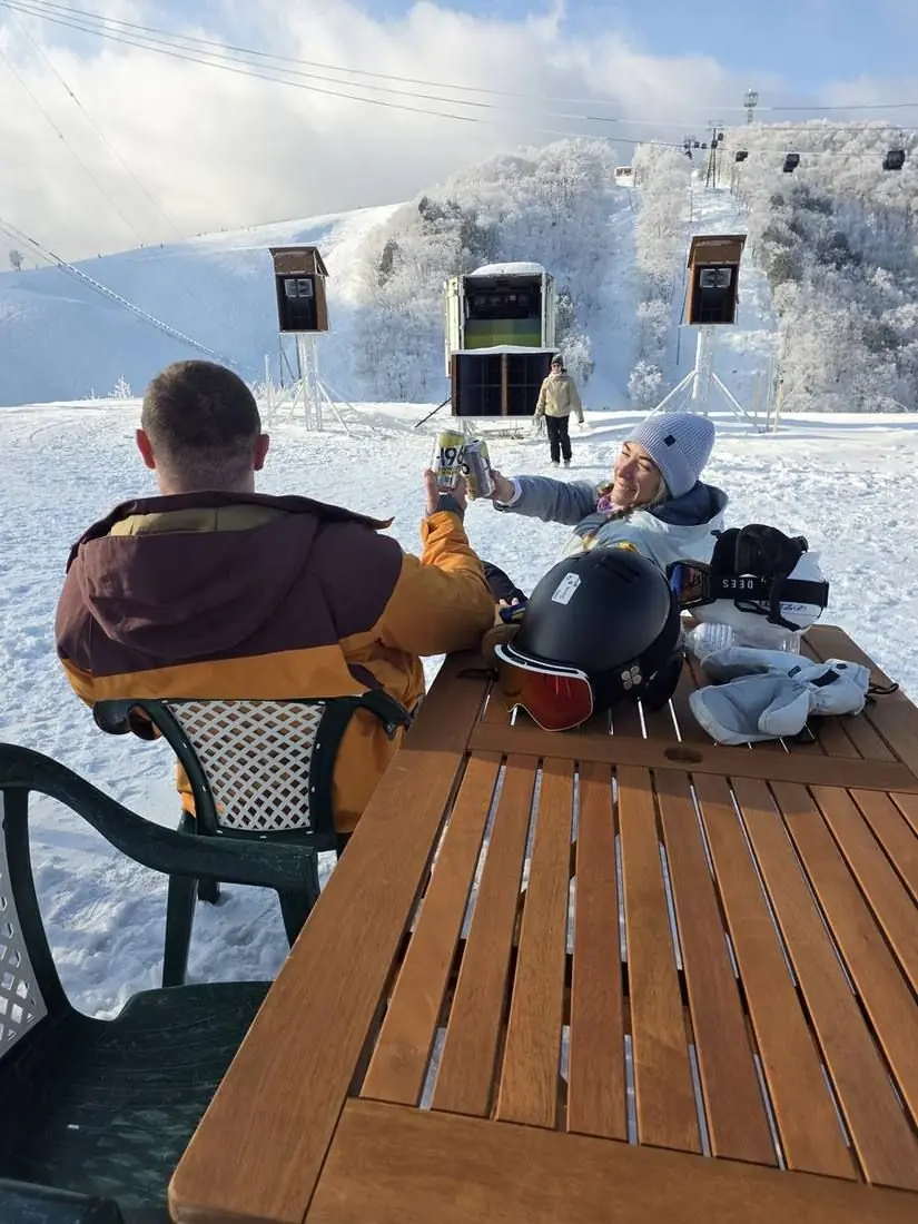 A drink on the table out on the deck in the sun